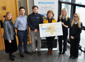 keystone group present cheque to marie curie charity